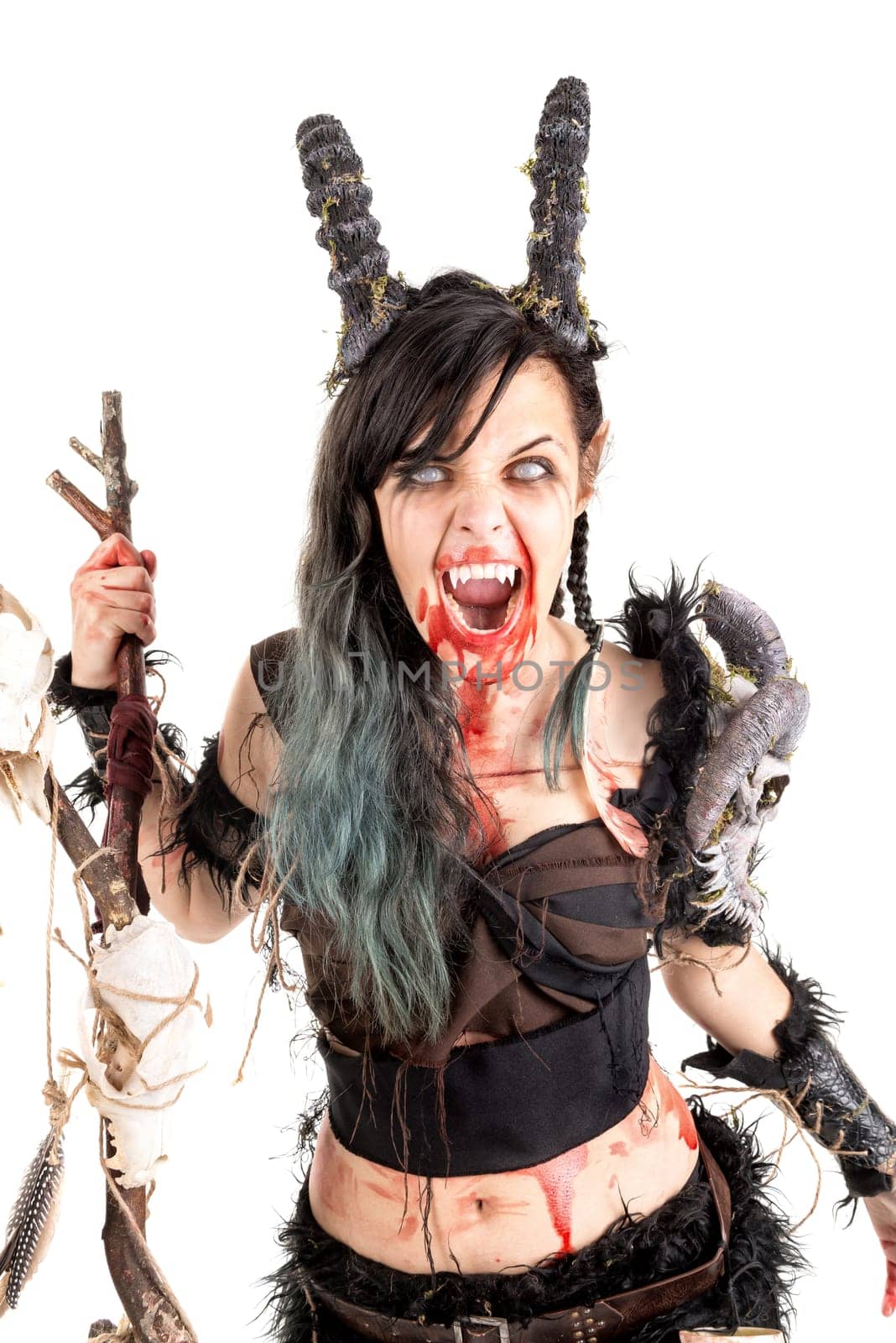 Faun sorceress with big horns and blood isolated in white