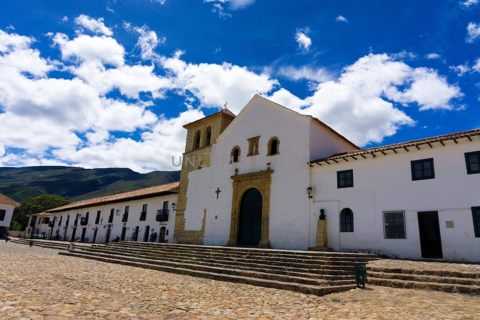 VILLA DE LEYVA, COLOMBIA - APRIL 29: Church and shops on the Plaza Mayor in Villa de Leyva, Colombia on April 29, 2016
