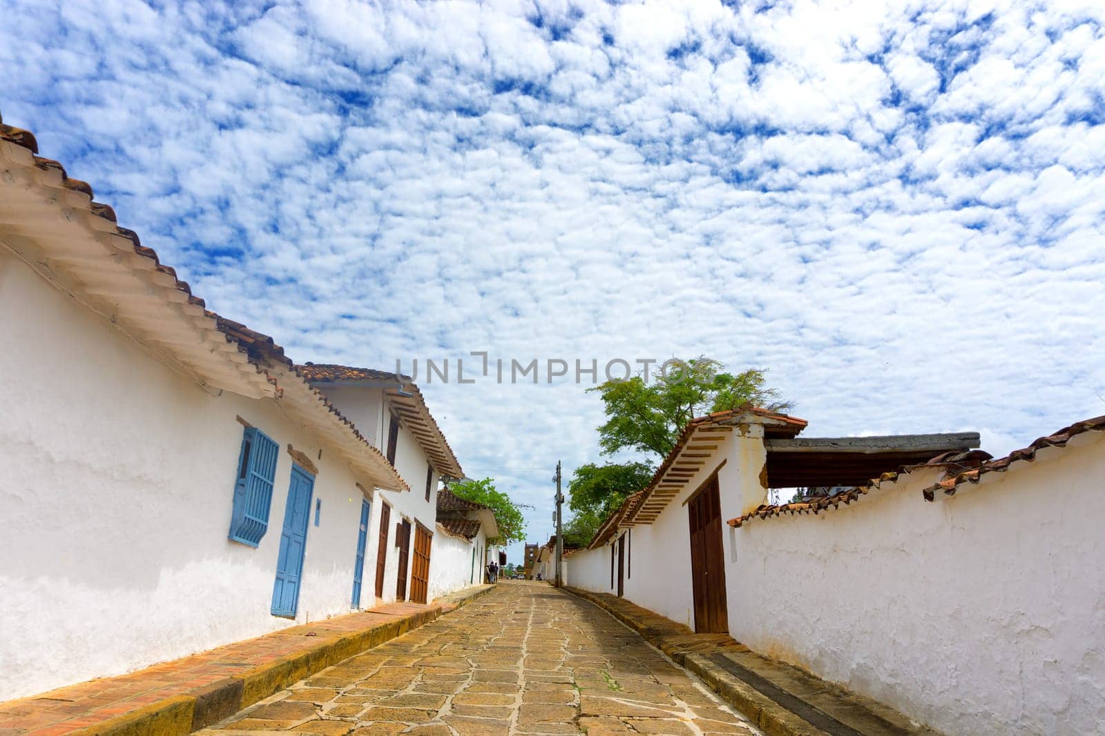 Sandstone street and white colonial architecture in Barichara, Colombia
