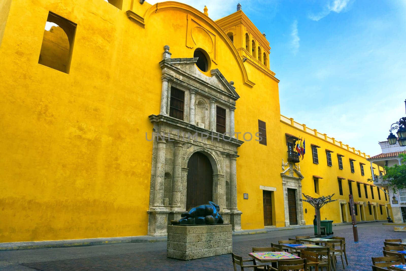 CARTAGENA, COLOMBIA - MAY 25: Statue by Fernando Botero in Santo Domingo plaza by a yellow church in Cartagena, Colombia on May 25, 2016