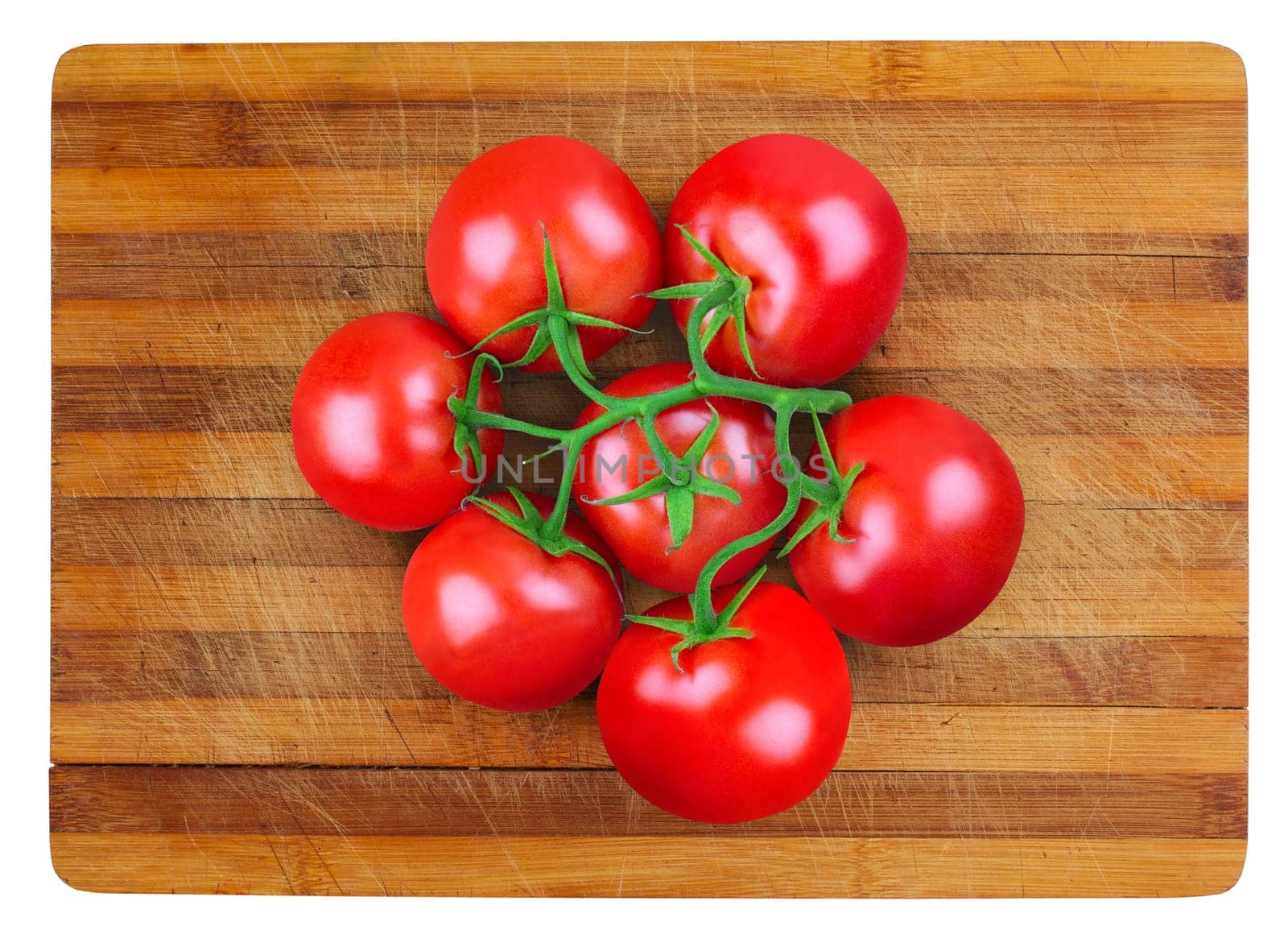top view of a bunch of fresh tomatoes on a wooden cutting board