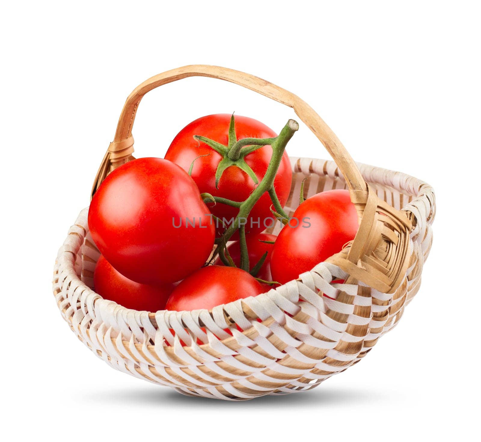 front view of a bunch of tomatoes in a wood basket isolated on white