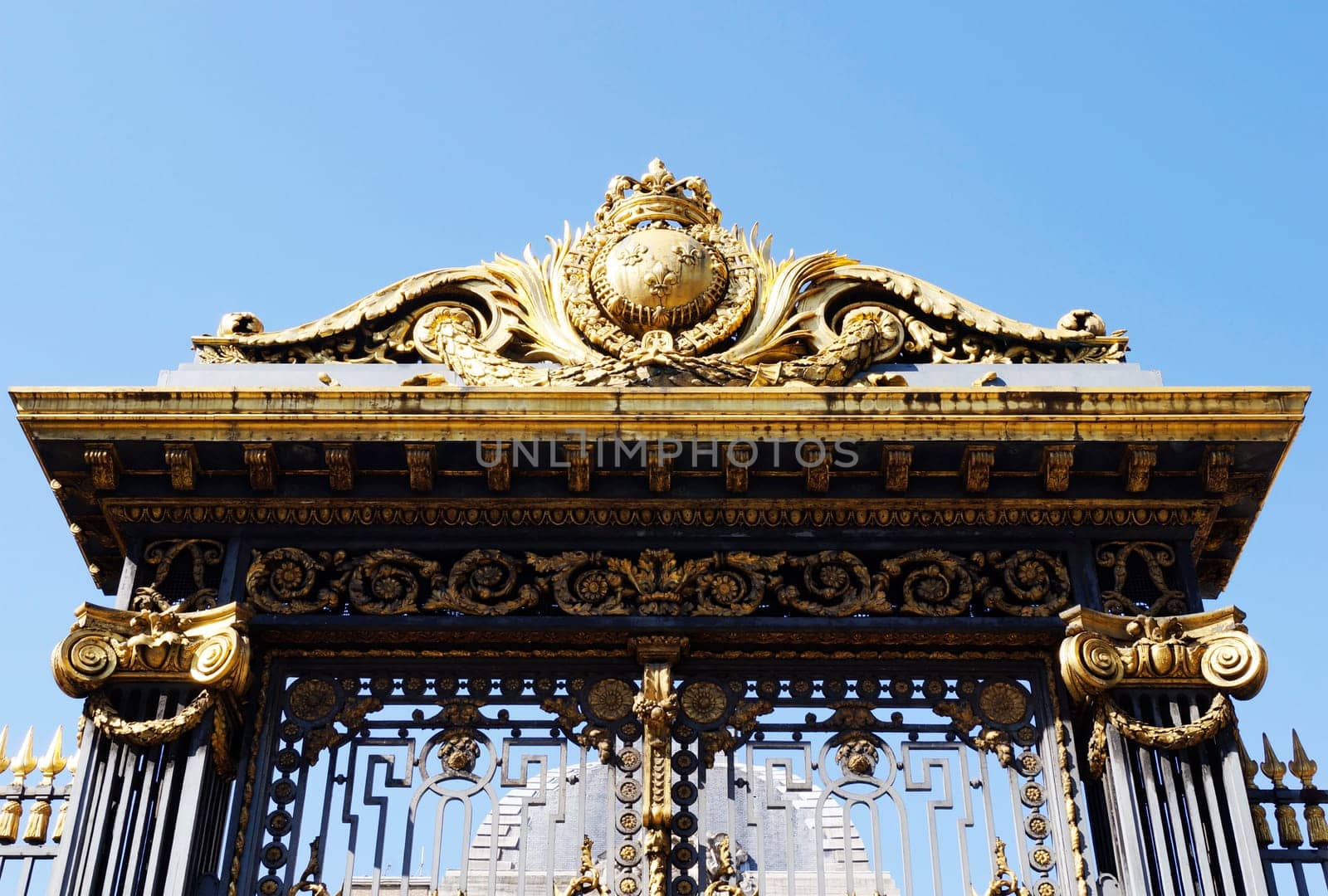 Golden decoration on main gate of Palace of Justice (Palais de Justice) in Paris, France