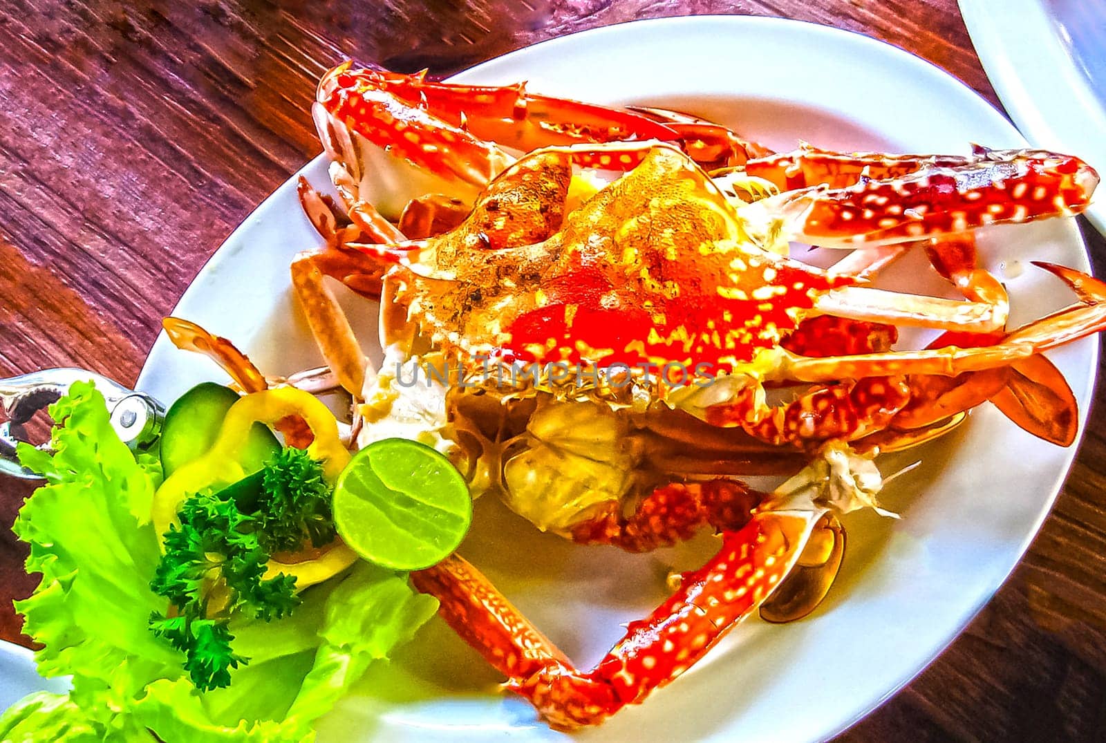 Crab with lime on a white plate