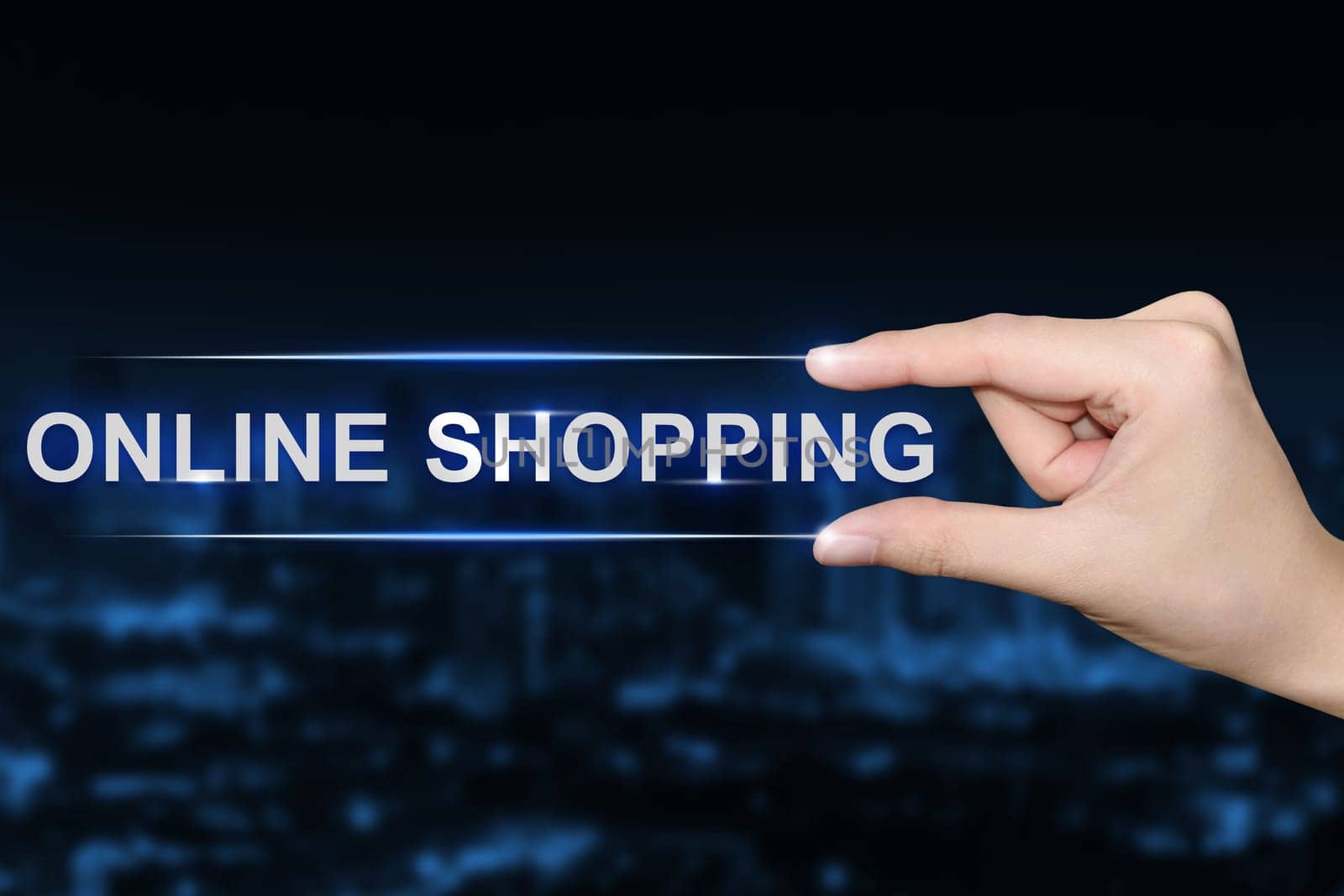 hand pushing online shopping button on blurred blue background