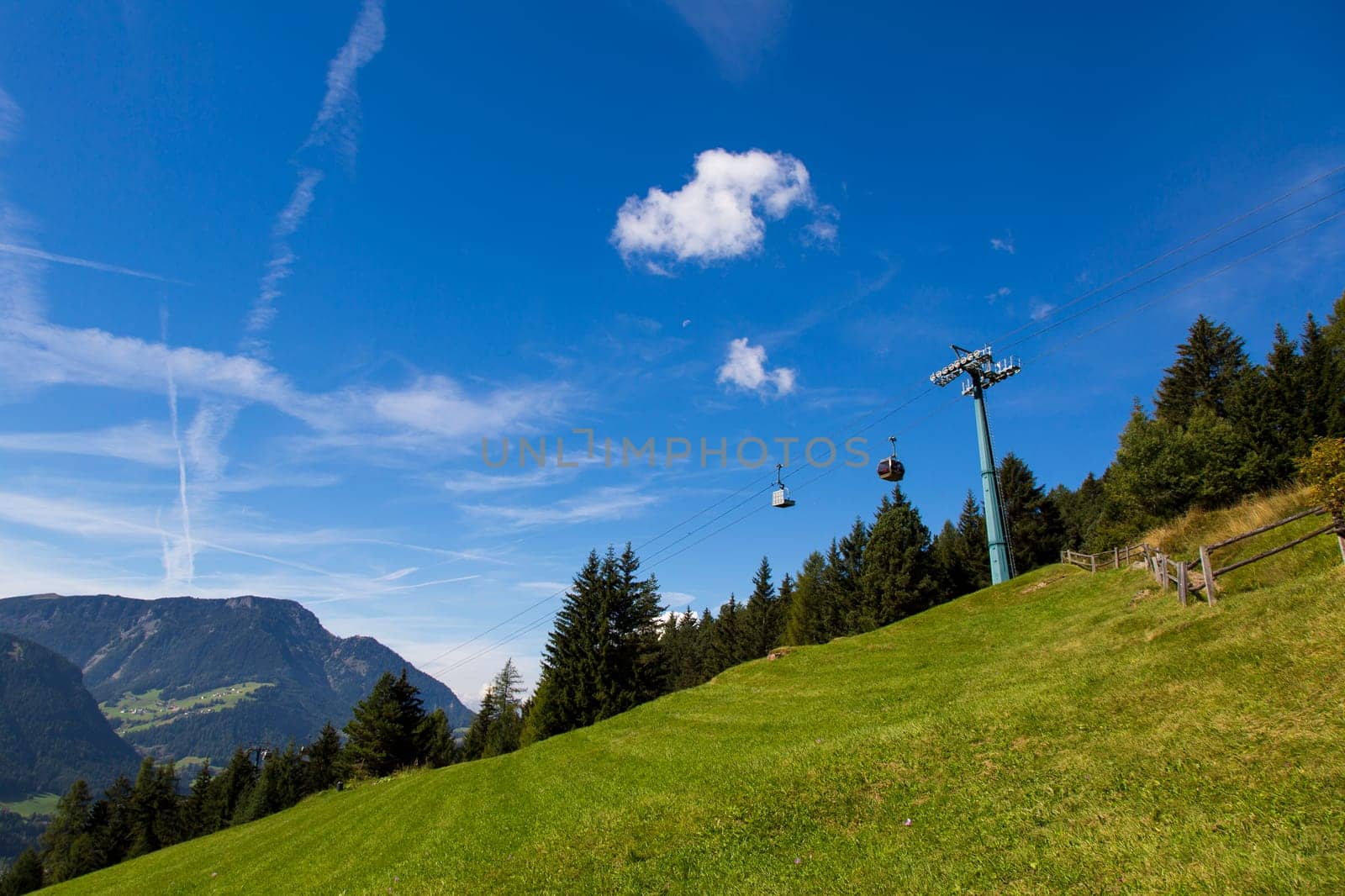 Bottom view of a cableway in a sunny day in Seiser Alm