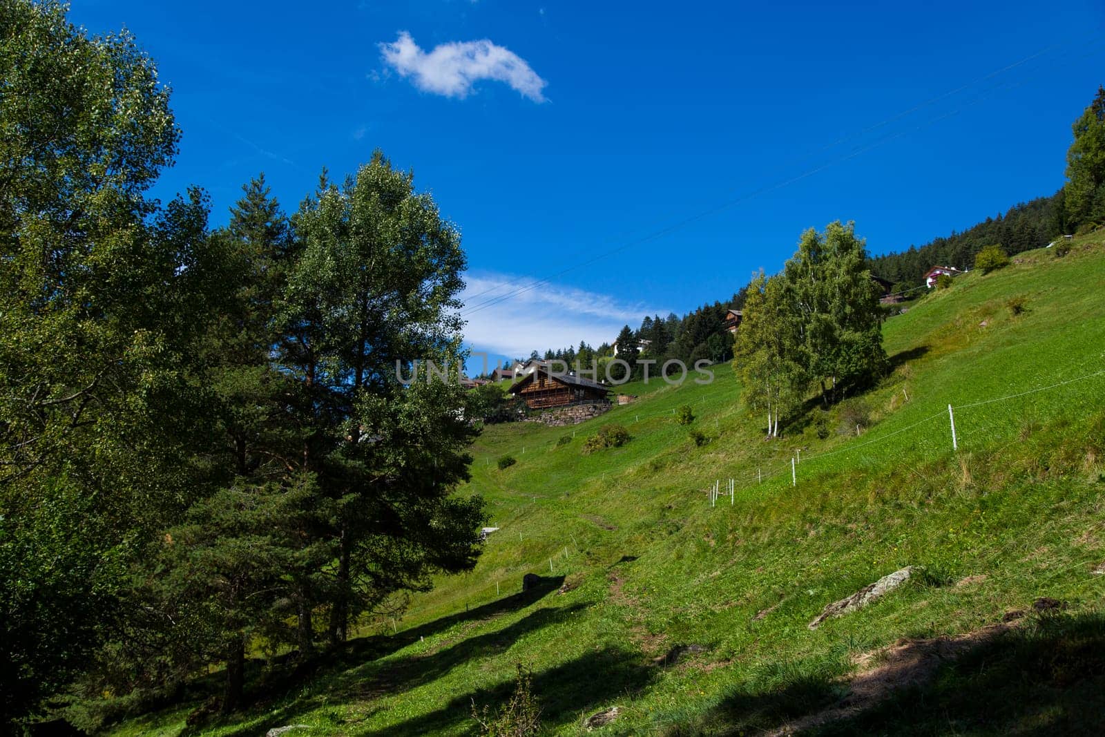 Distant view of a shelter in Seiser Alm on a sunny day