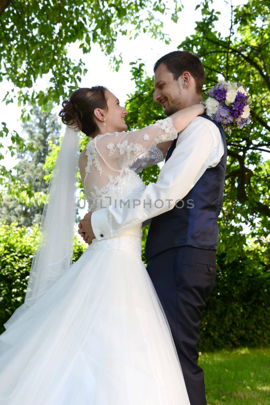 Happy bridal couple embraces each other