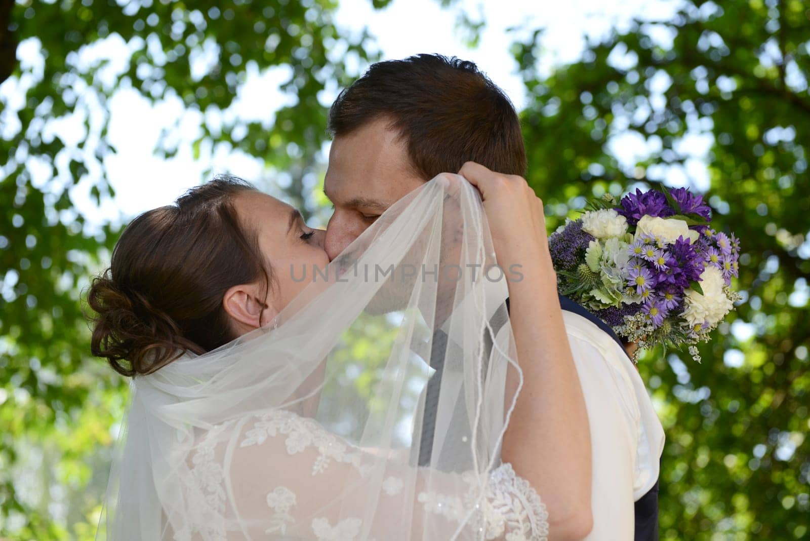 Kissing bridal couple