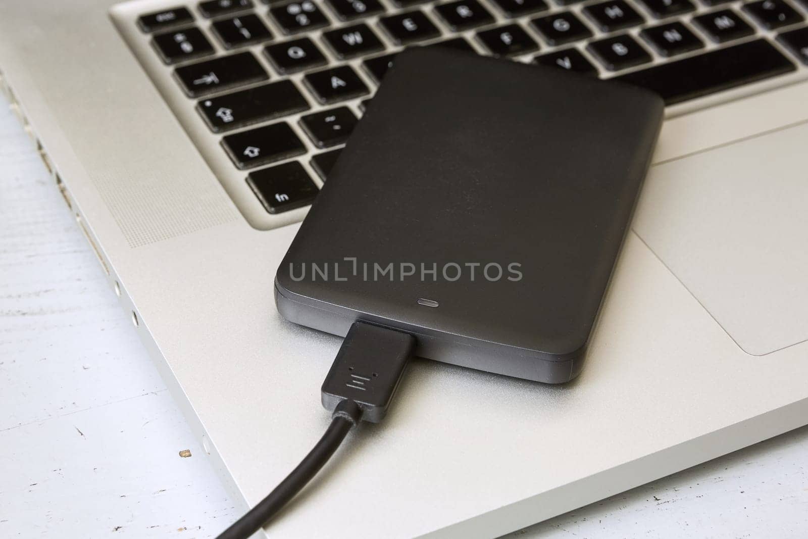 External Hard Disk Over Laptop Keyboard.
