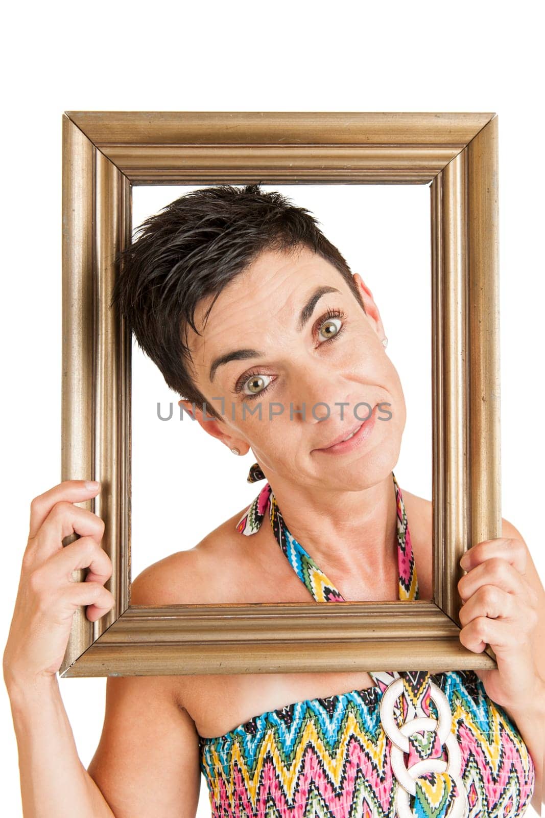 Upper body view of a middle-aged black-haired woman with gilded picture frames against a white background
