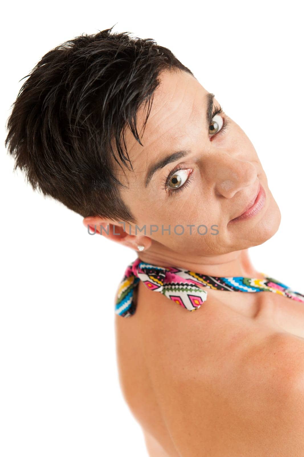 Head-and-shoulder view of a black-haired woman with a free shoulder from the right back against a white background smiling into the camera.