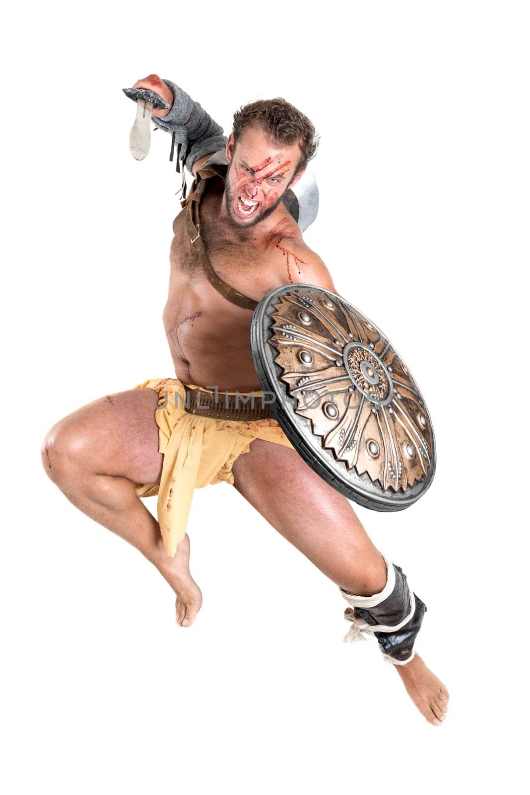 Ancient warrior or Gladiator jumping isolated in a white background