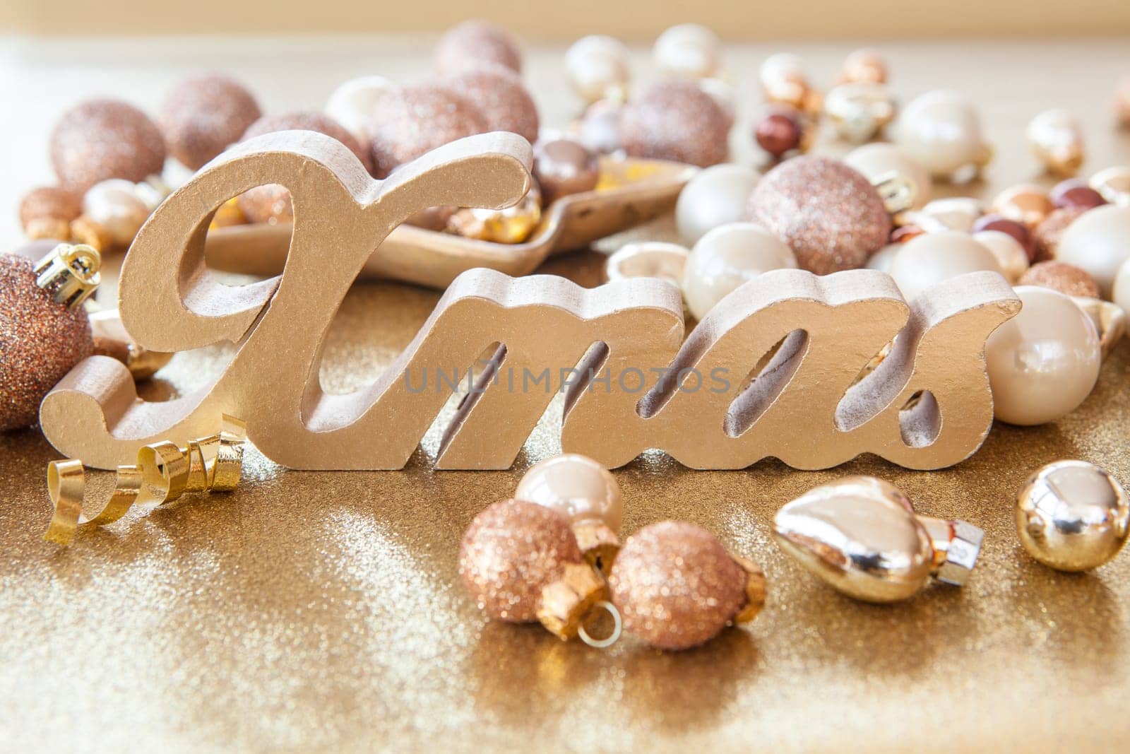 Scattered Christmas decorations with a golden background