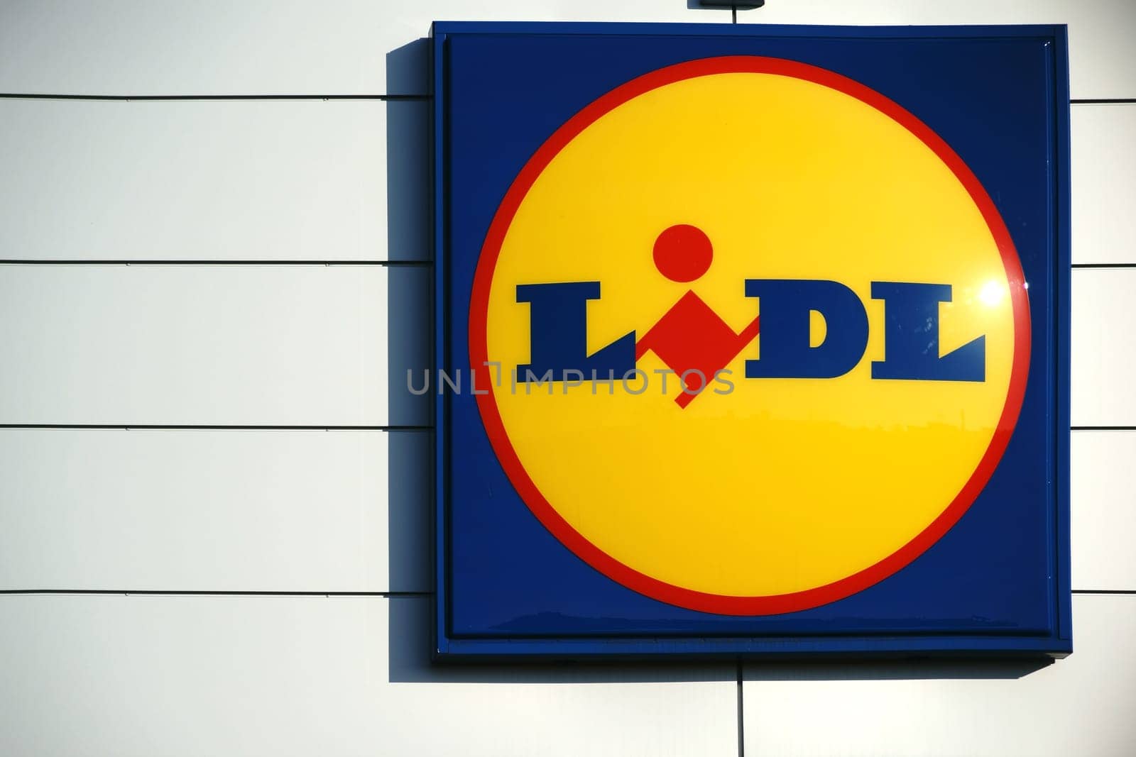 Mainz,Germany - October 29,2016: The luminous company sign of the food discounter Lidl on the façade of a food market on October 29,2016 in Mainz.