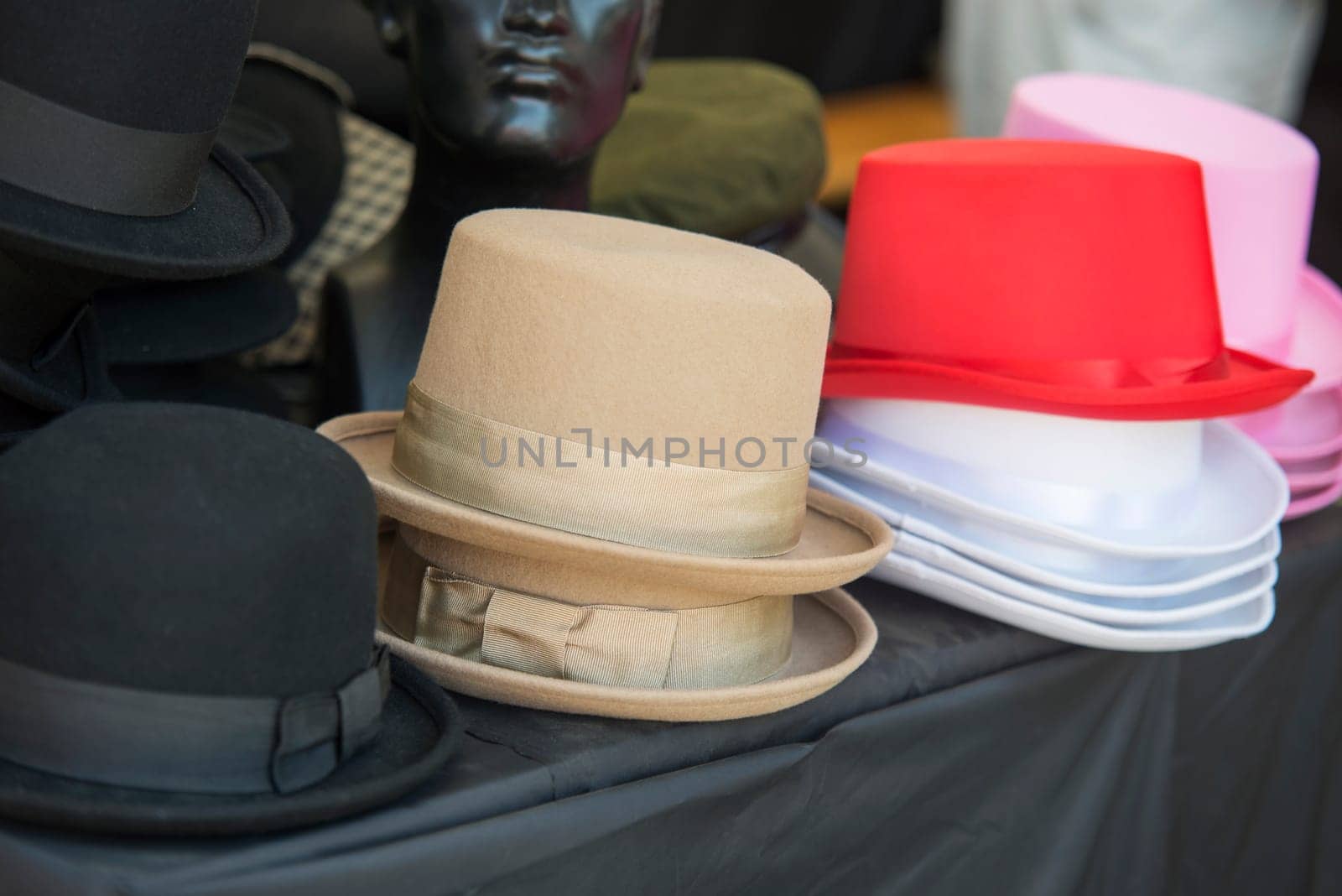 close up on hats of felt for sale at a flea market