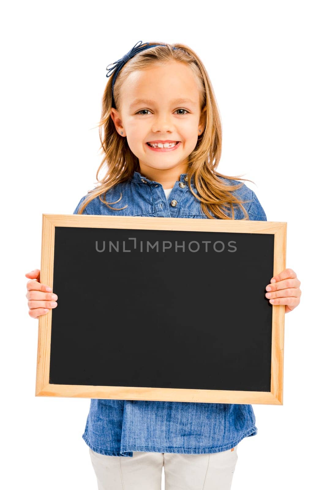 Beautiful little girl holding and showing a speech balloon