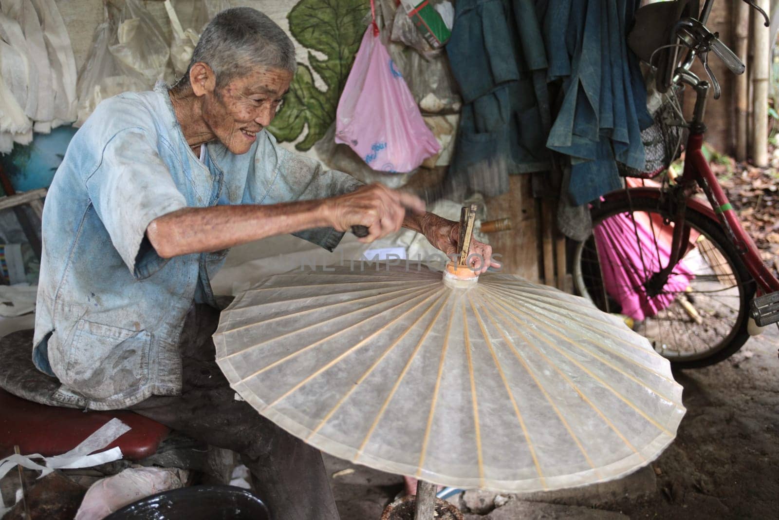 an Umbrella Factory near the city of chiang mai in the north of Thailand in Southeastasia. ...