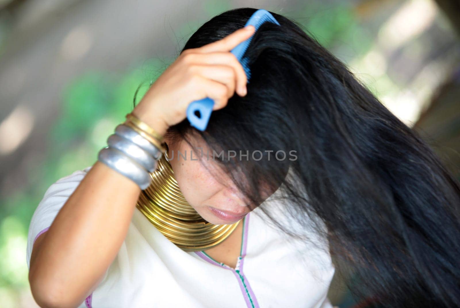 a traditional longneck women of the Paudang minority from Burma in a village north of chiang mai in the north of Thailand in Southeastasia. ...