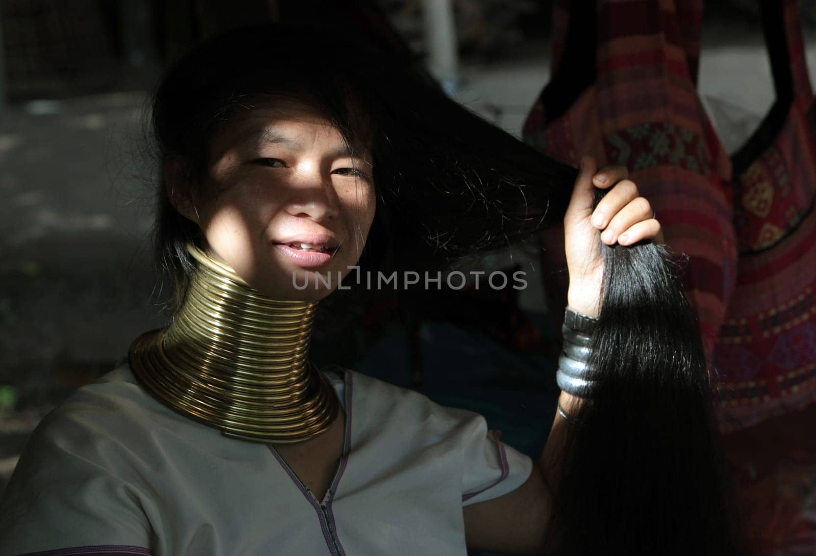 a traditional longneck women of the Paudang minority from Burma in a village north of chiang mai in the north of Thailand in Southeastasia. ...