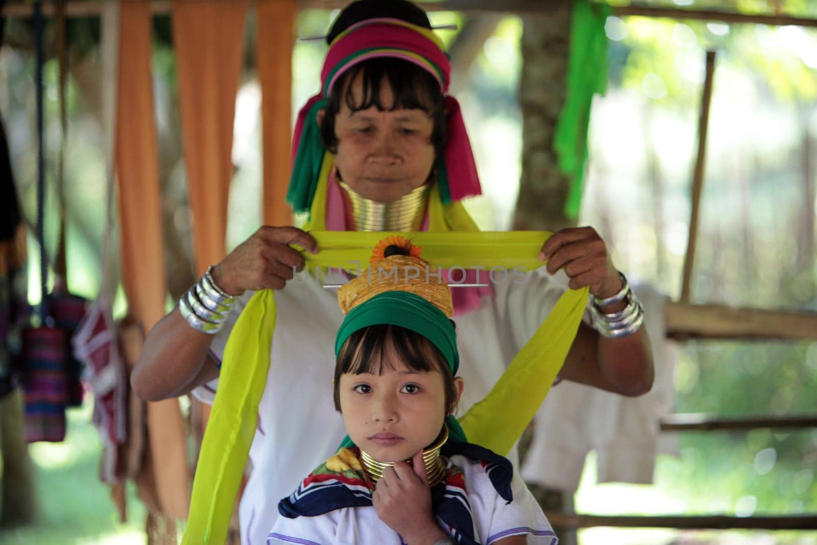 a traditional longneck women of the Paudang minority from Burma in a village north of chiang mai in the north of Thailand in Southeastasia. ...