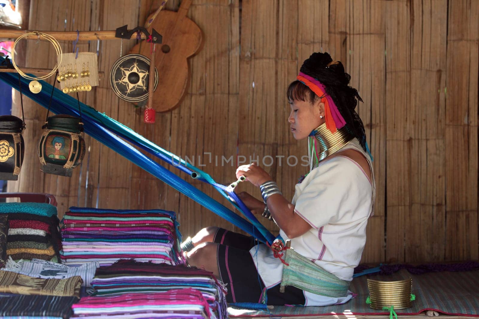 a traditional longneck women of the Paudang minority from Burma in a village north of chiang mai in the north of Thailand in Southeastasia. ...