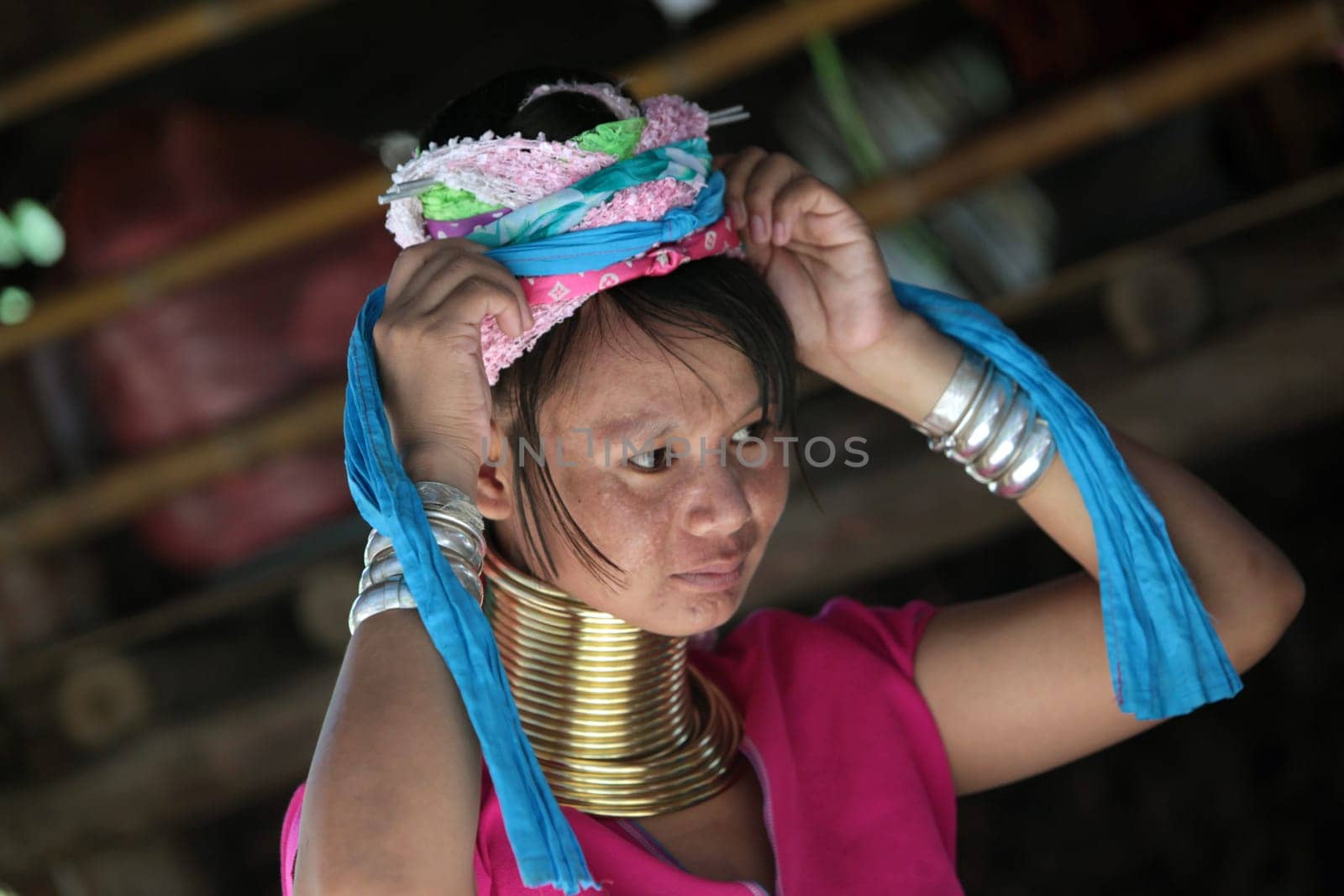 a traditional longneck women of the Paudang minority from Burma in a village north of chiang mai in the north of Thailand in Southeastasia. ...