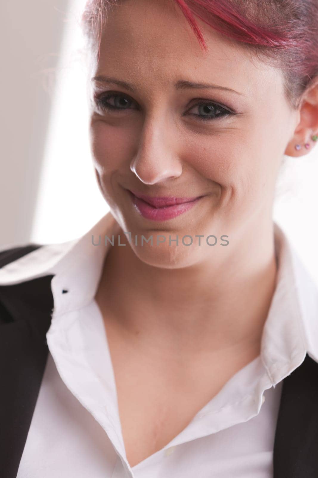 red haired businesswoman with the what are you doing expression