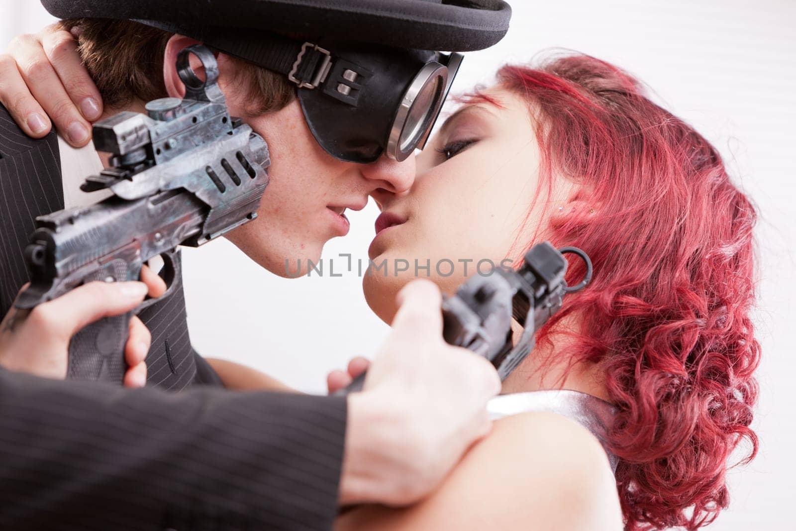 a weird couple of strange business superheroes in which she loves and hates him and they are attracted and the have to kill each other