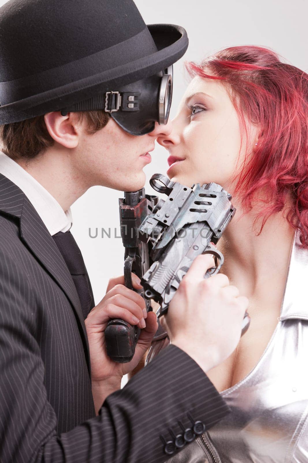 a weird couple of strange business superheroes in which she loves and hates him and they are attracted and the have to kill each other