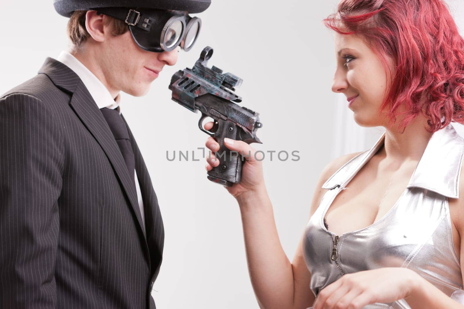 a weird couple of strange business superheroes in which she loves and hates him and they are attracted and the have to kill each other
