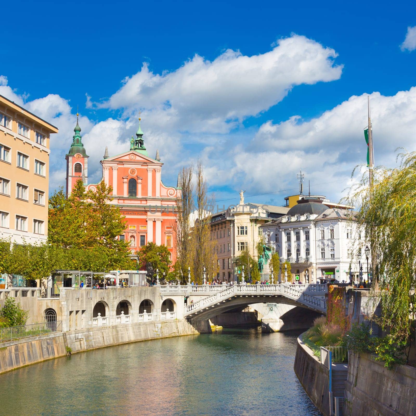 Romantic Ljubljana city center. River Ljubljanica, Triple Bridge - Tromostovje, Preseren square and Franciscan Church of the Annunciation. Ljubljana Slovenia Europe.