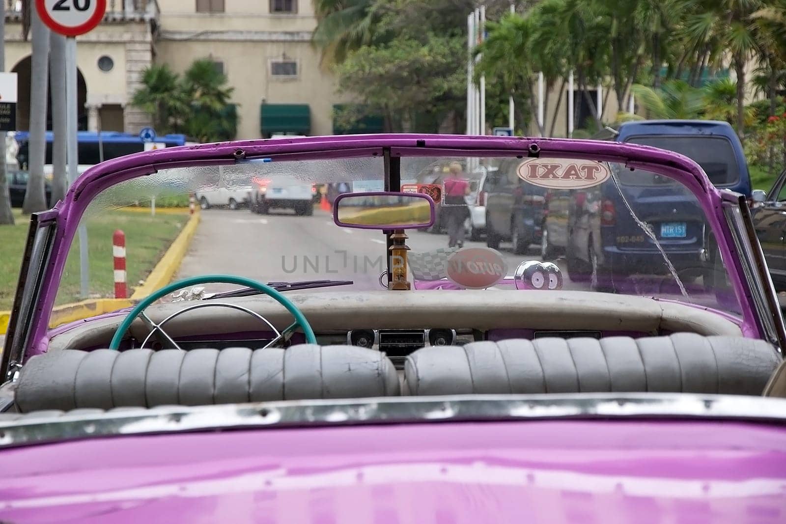 old classic american car is parked along the street to the Hotel Nacional at the Havana