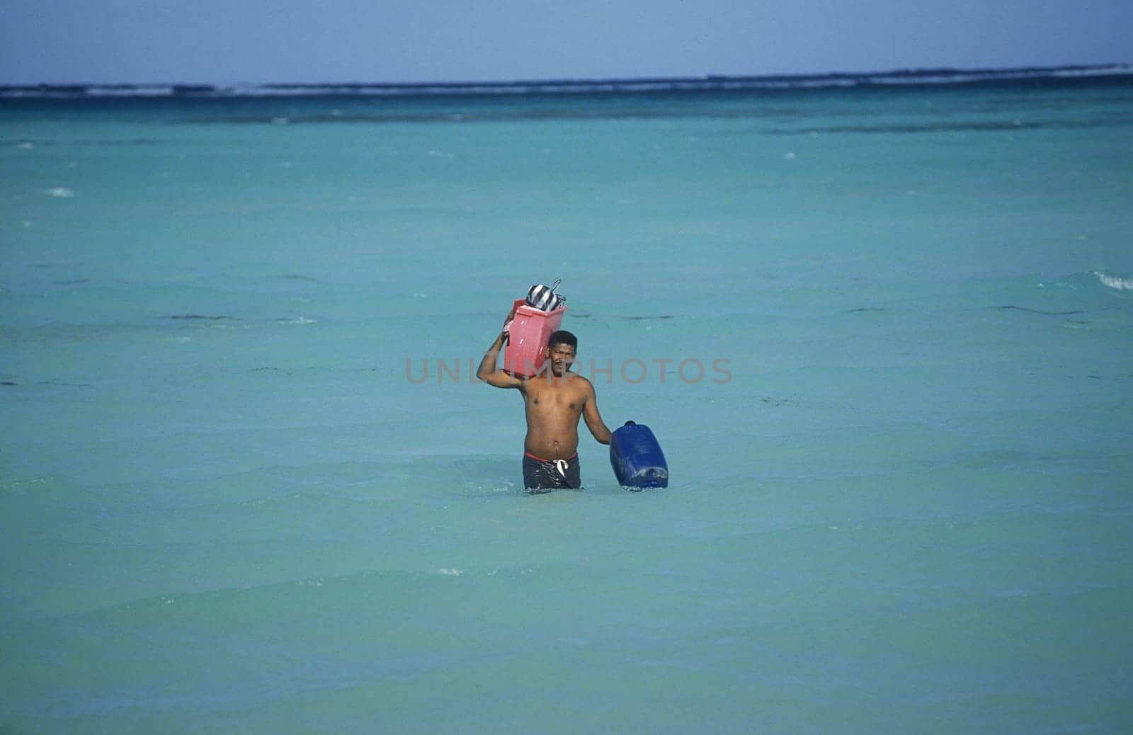 A Fisherman on the way from the Boat to the Village of Las Terrenas on Samanaon in The Dominican Republic in the Caribbean Sea in Latin America.