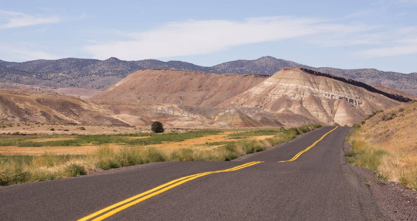 The road winds through colorful mineral and rock deposits in Oregon