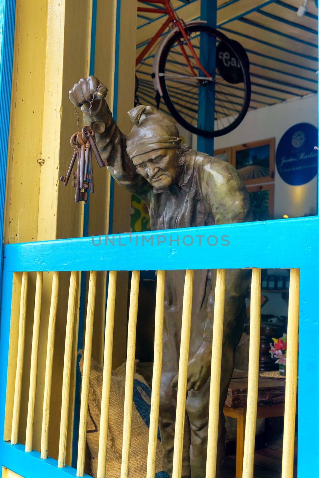 SALENTO, COLOMBIA - JUNE 6: Statue holding keys in a coffee shop in Salento, Colombia on June 6, 2016