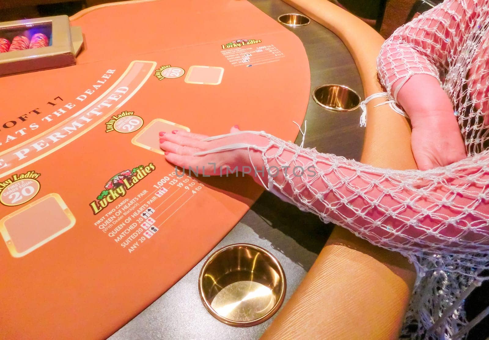 Las Vegas, United States of America - May 11, 2016: The woman sitting at the card game table in the Fremont Casino at Las Vegas, United States of America