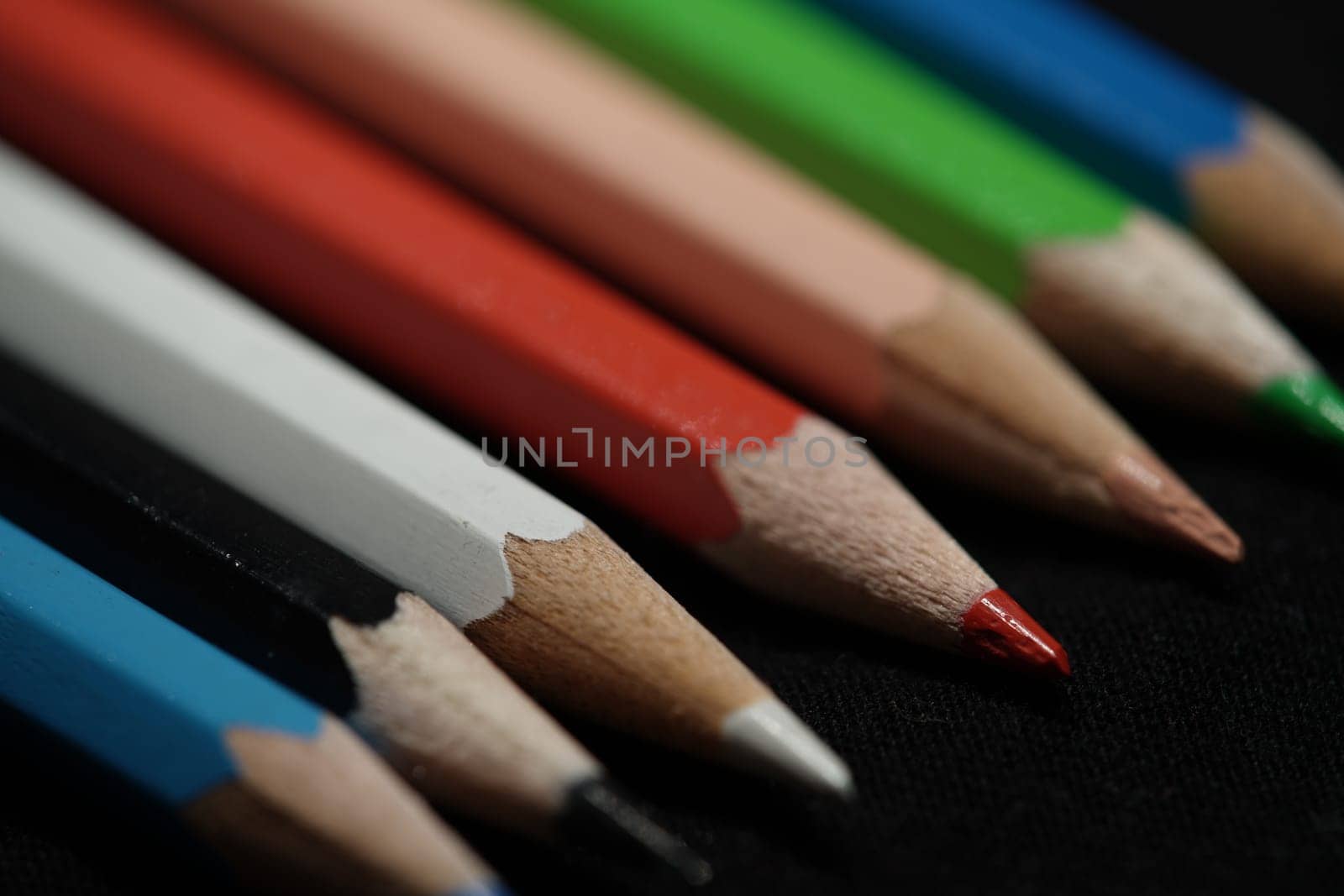 colorful pencils lie on a table