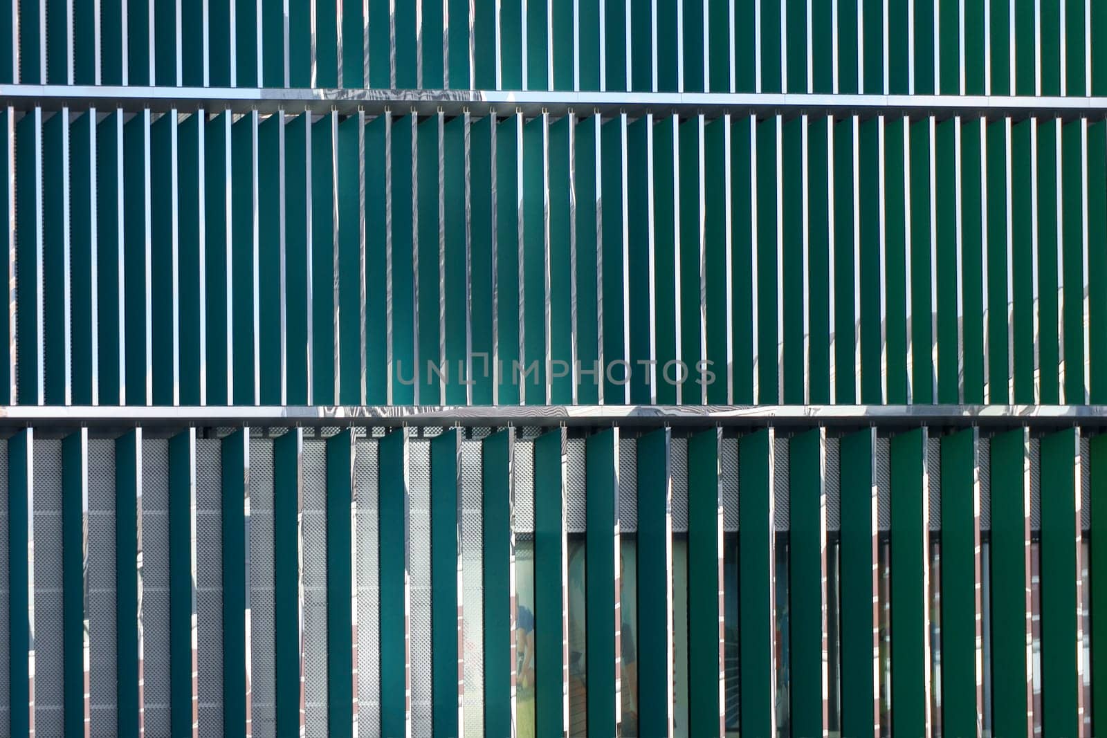 The close-up of a modern shiny plastic wall cladding.