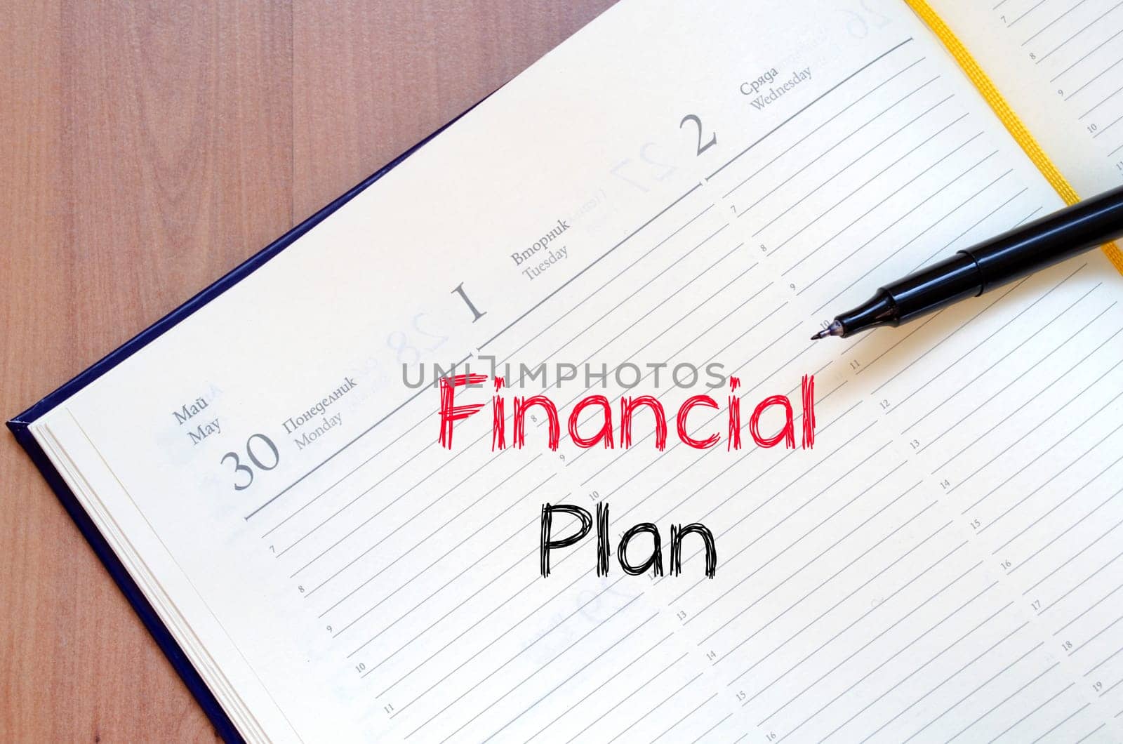 Financial plan text concept write on notebook