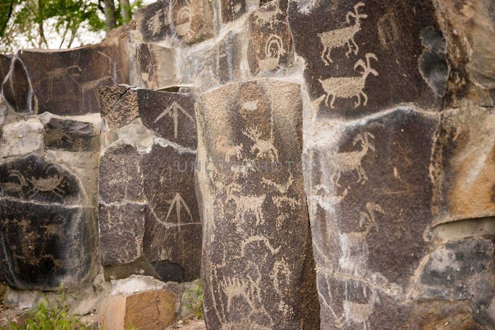 Primitive rock drawings hundreds of years old we call Petroglyphs