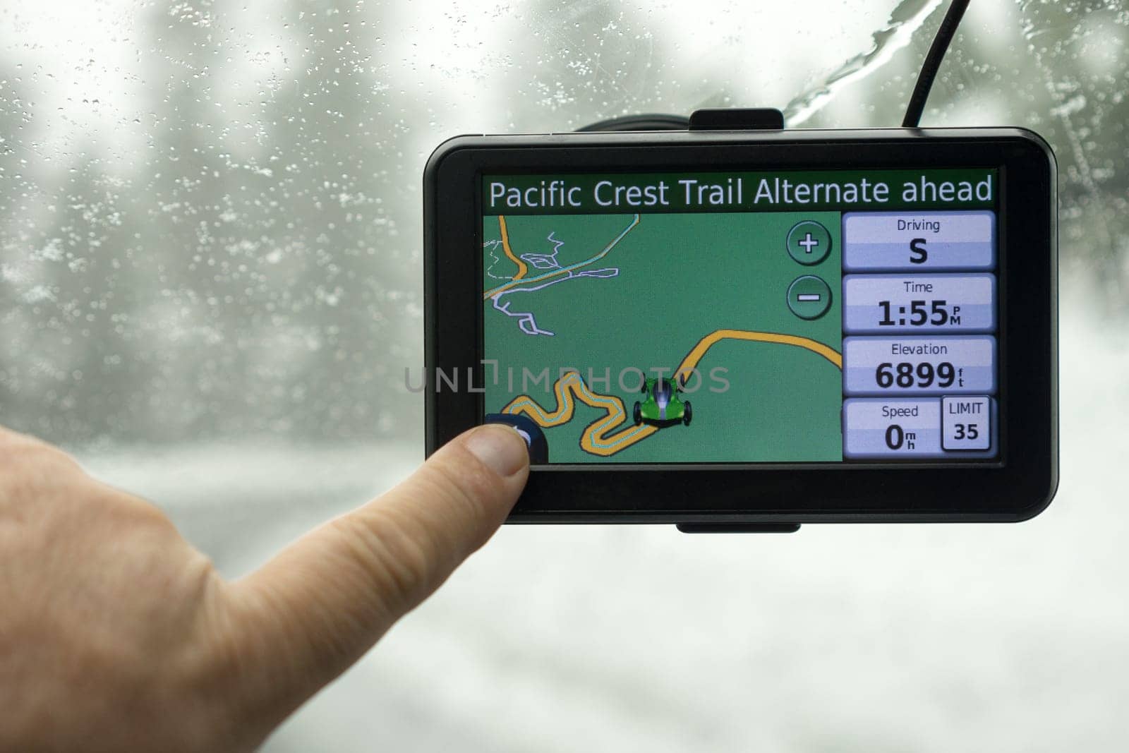 A driver picks a route on his mobile GPS