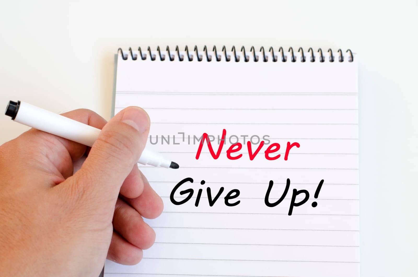 Never give up text concept write on notebook