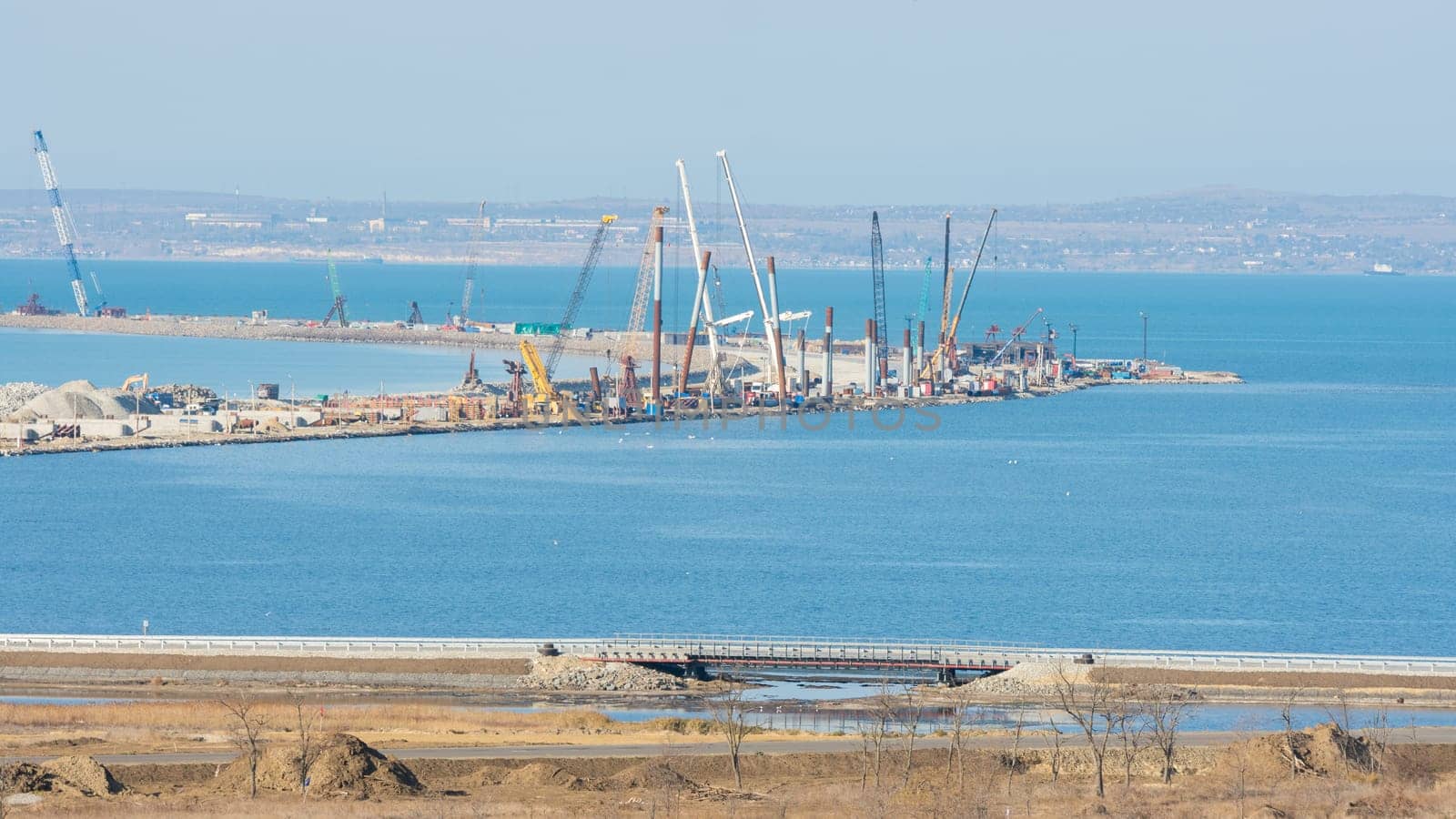 Taman, Russia - November 5, 2016: Construction of a bridge across the Kerch Strait, the views of the Tuzla Spit from the Taman Peninsula, as of November 2016