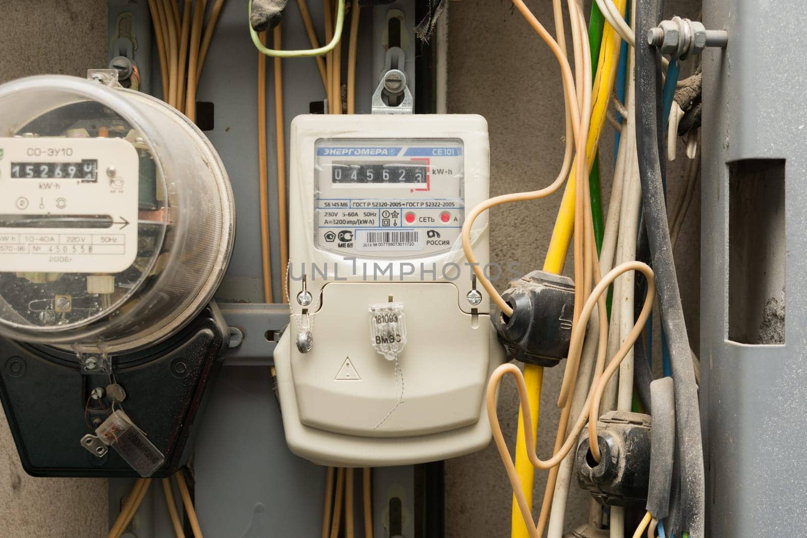 Volgograd, Russia - October 10, 2016: Electronic electric meter electricity company "Energomera"", close to a mechanical counter"