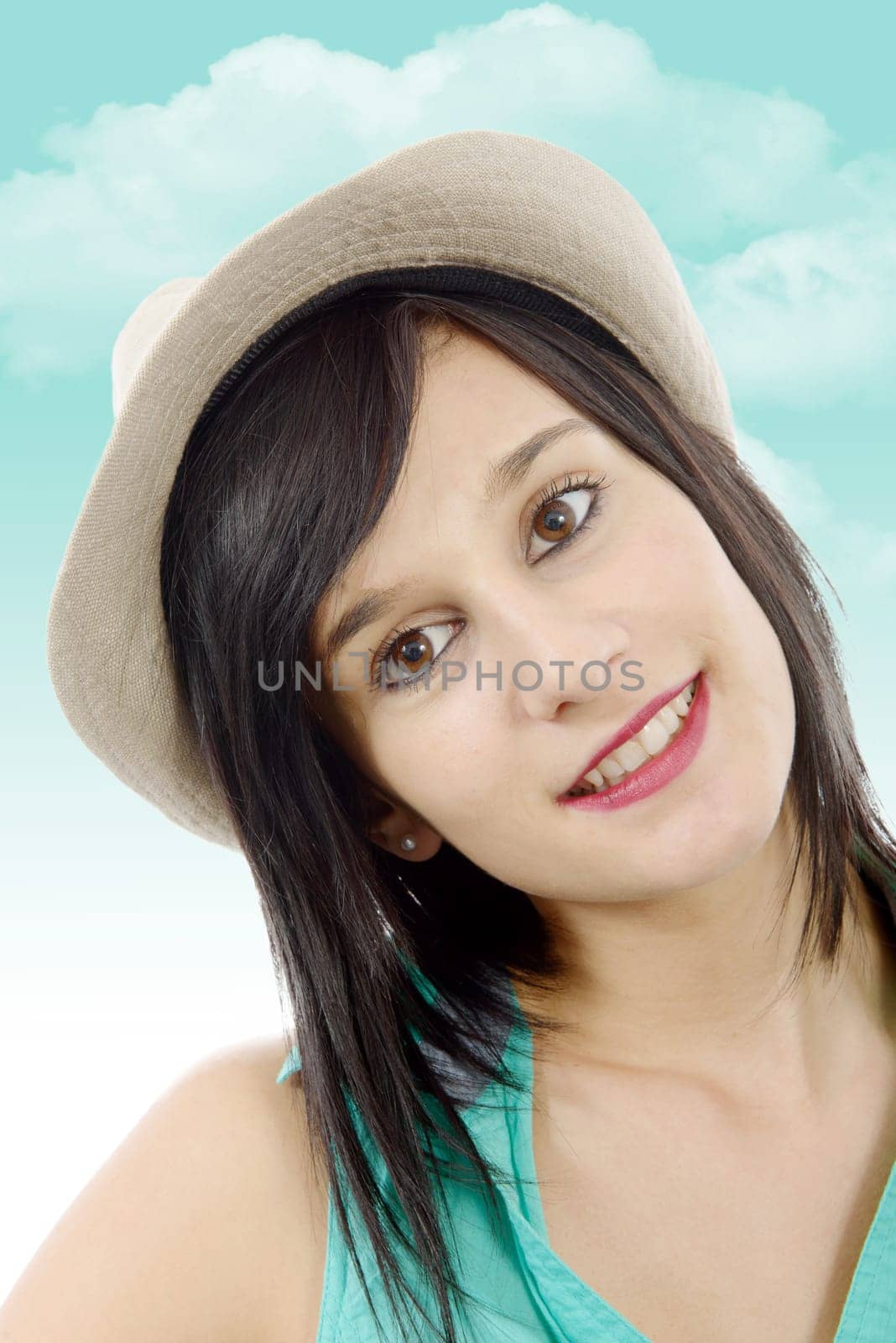 pretty young brunette woman with a summer hat