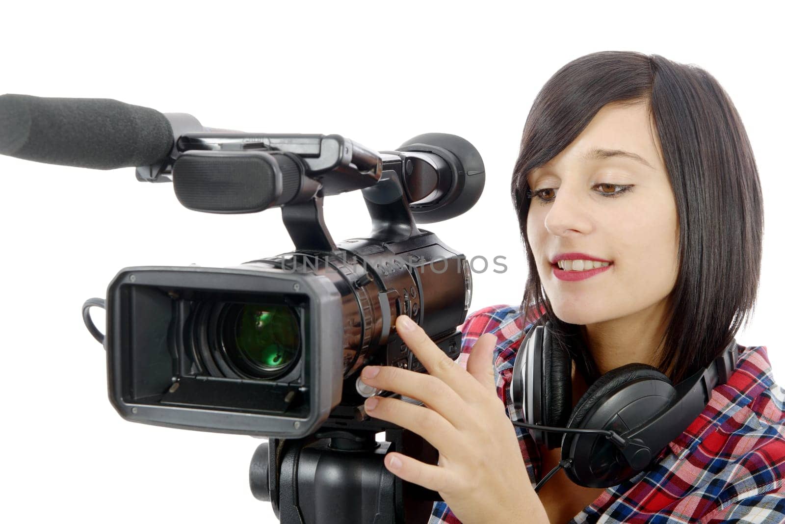 pretty young brunette girl with a professional camcorder, isolated on white background