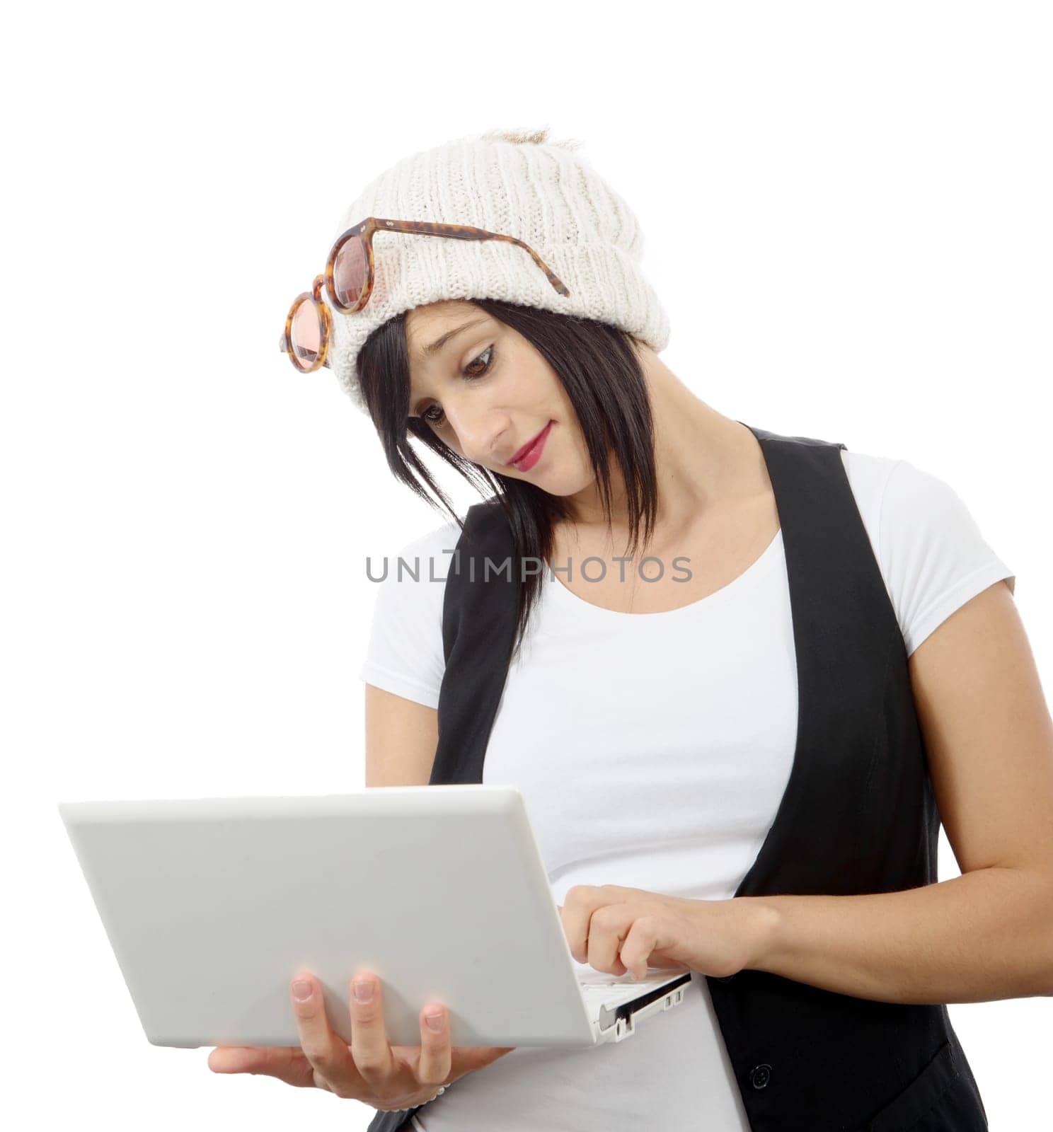 young brunette girl with a laptop isolated on white background