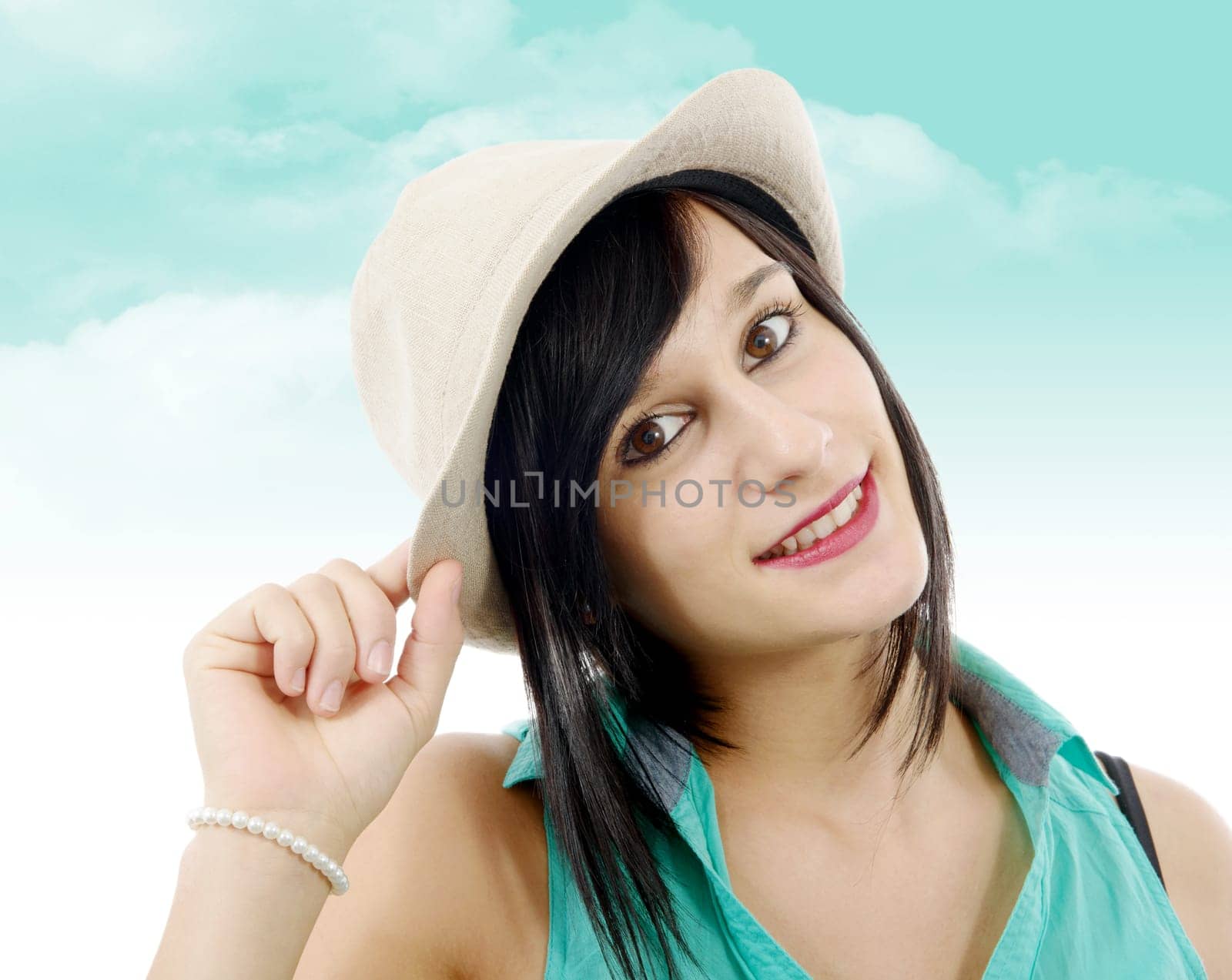 pretty young brunette woman with a summer hat
