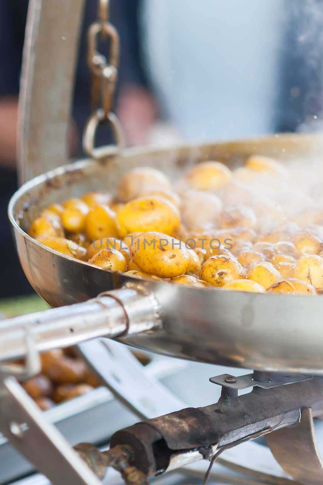 New potatoes. Fried in a pan. Italian recipe: potatoes cooked to Salento. Selective focus.
